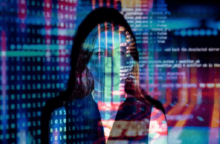 Woman with projections of digital across her face