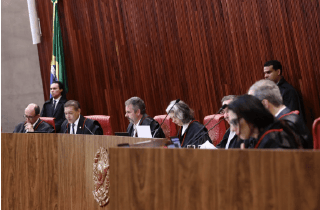 Members of the Superior Electoral Court sitting in session at a wooden bench