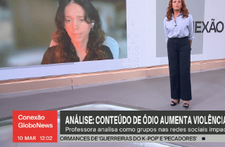 News studio set with woman anchor and interviewee on screen